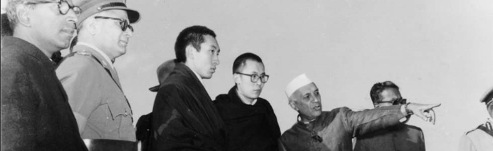 Prime Minister Jawahahrlal Nehru pointing out a landmark to H.H: the Dalai Lama and Panchen Rinpoche, 1957