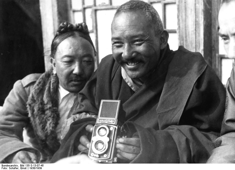 Lhasa. Kyibu watches Möndro taking photos.